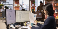 Tech startup HR senior manager vetting software development position applicants, ensuring their skills are strong enough match for role. Asian recruiter assessing candidate work experience, reading CV